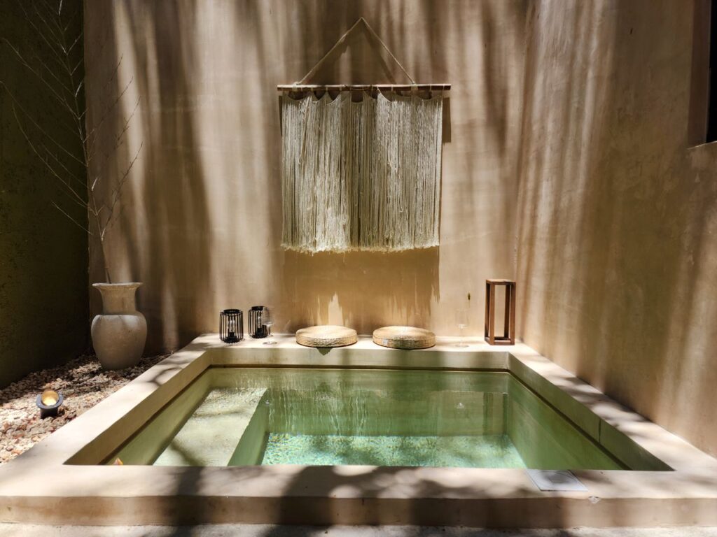 A serene indoor spa setting with natural light and minimalist decor, perfect for relaxation.